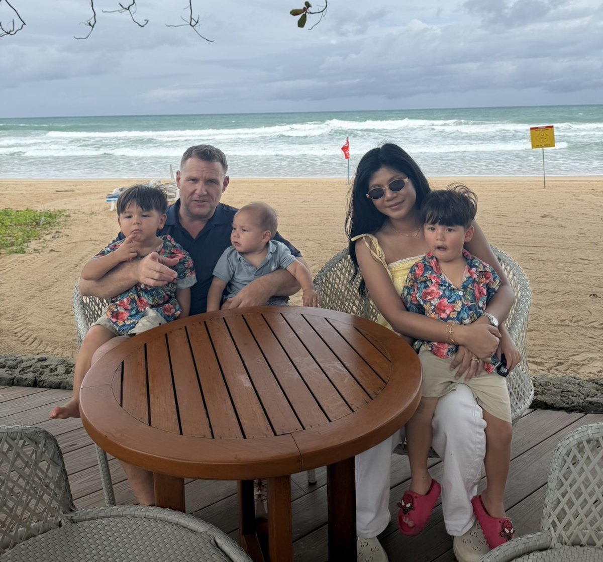 Ben, Ploy and their three sons on a beach in Thailand, September 2026
